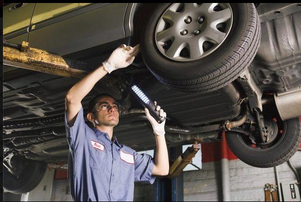 mechanic servicing car at clausen automotive, madison, wi